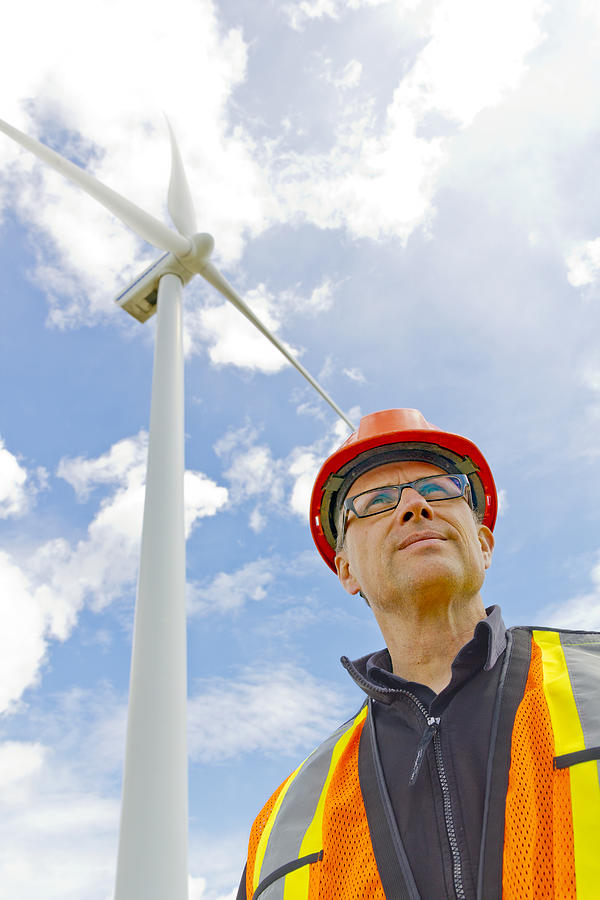 Clean Energy Worker and Wind Mill Photograph by Shotbydave