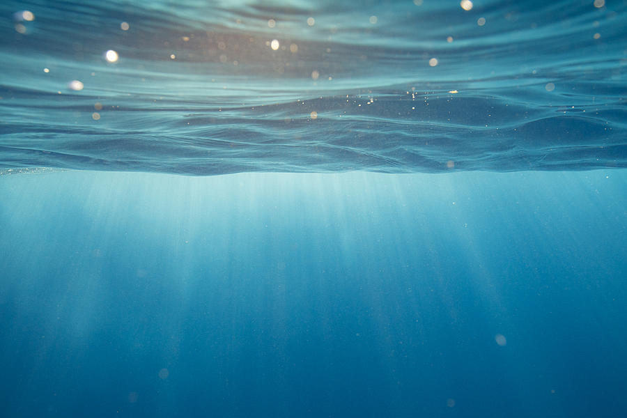 Clear blue aqua marine ocean with with light rays coming through water surface Photograph by Philip Thurston