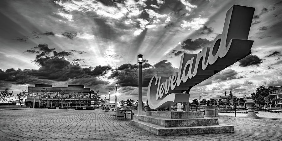 Black And White Photograph - Cleveland Script Sign Sunrise Panorama On North Coast Harbor - Black and White Edition by Gregory Ballos