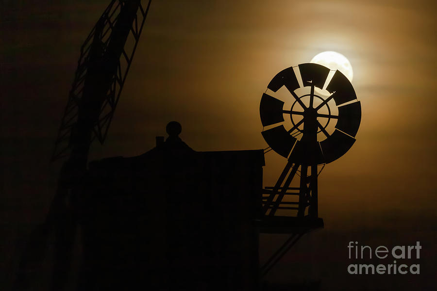 Cley windmill silhouette with full moon fantail Photograph by Simon Bratt