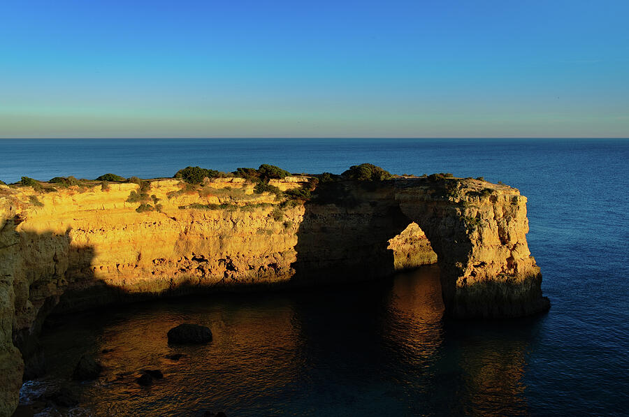 Cliff Arch in Albandeira Beach during Sunset Photograph by Angelo DeVal
