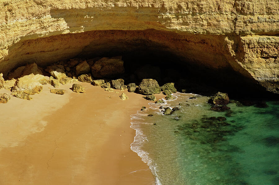 Cliff Cave in Praia Deserta Photograph by Angelo DeVal