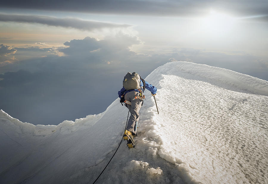 Climber on a snowy ridge Photograph by Buena Vista Images