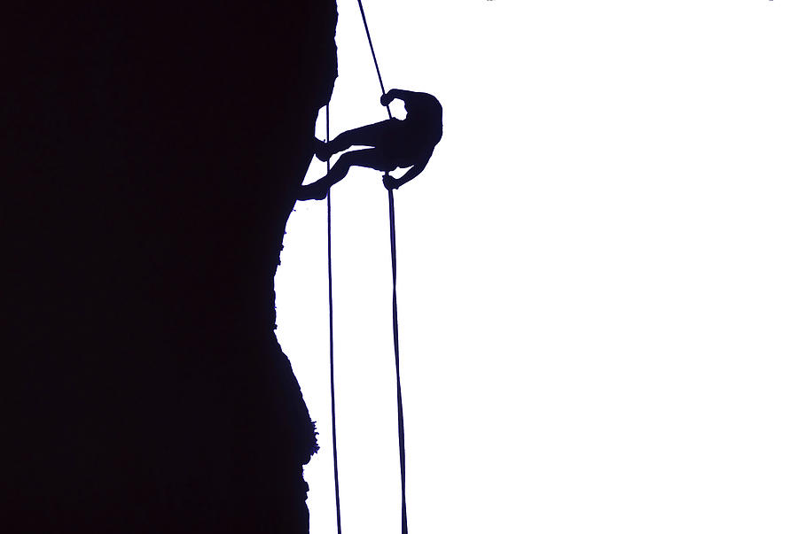 Climber on rappel Photograph by Steve Estvanik