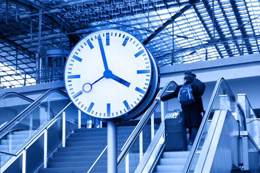 Clock And Commuters In Front Of Modern Railway Station Ceiling Photograph by Sebastian-julian