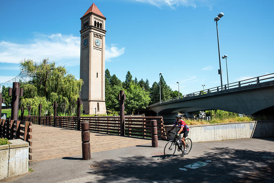 Clocktower Bridges and Cyclist Photograph by Tom Cochran