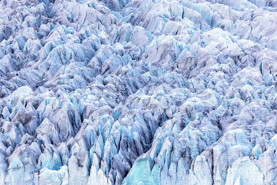 Close up detail of the compressed glacial blue ice of the Fjallsjokull glacier, Southern Iceland. Part of the Vatnajokull National Park Photograph by Jane Rix