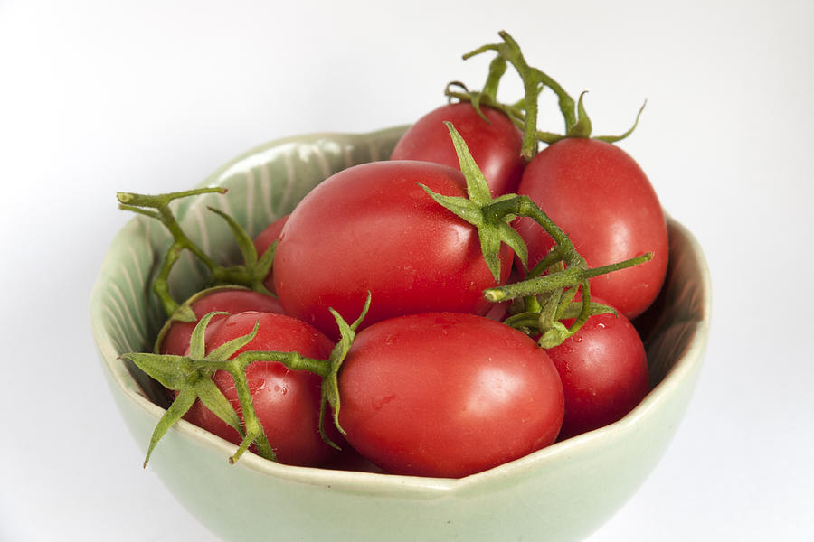 Close-up fresh tomatoes in green bowl Photograph by Sirirak
