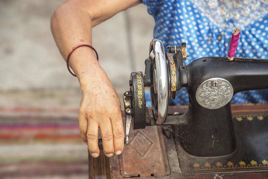 Close Up Image Of Lady Hands Sewing Her Cloth With  Old Sewing Machine Photograph by Greenaperture