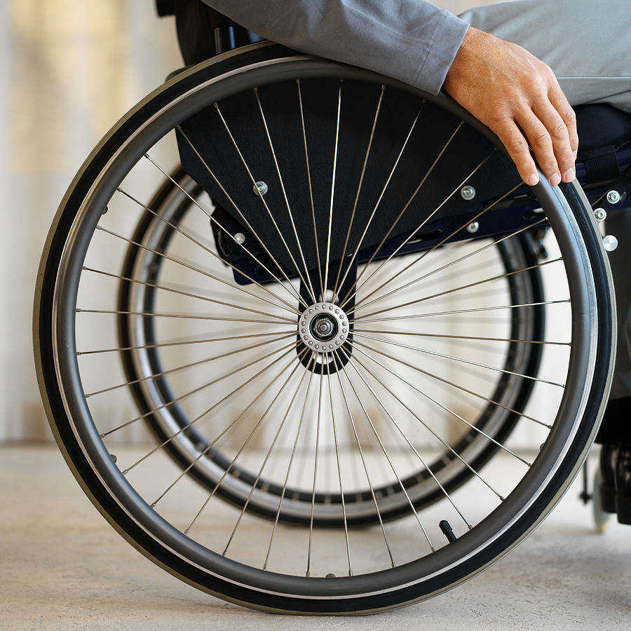 Close Up Mid Section View Of A Man Sitting In A Wheelchair Photograph by George Doyle