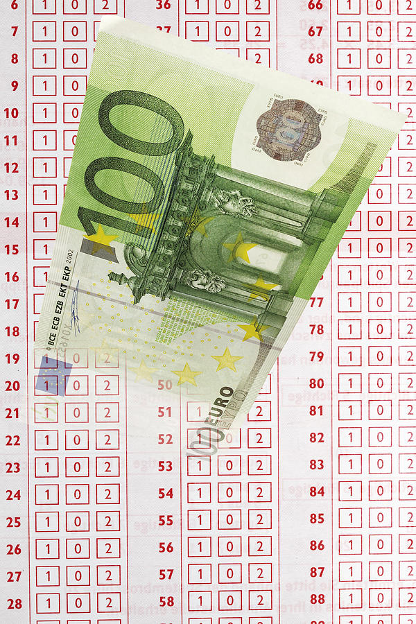 Close up of 100 euro note and betting slip Photograph by Tuned_In