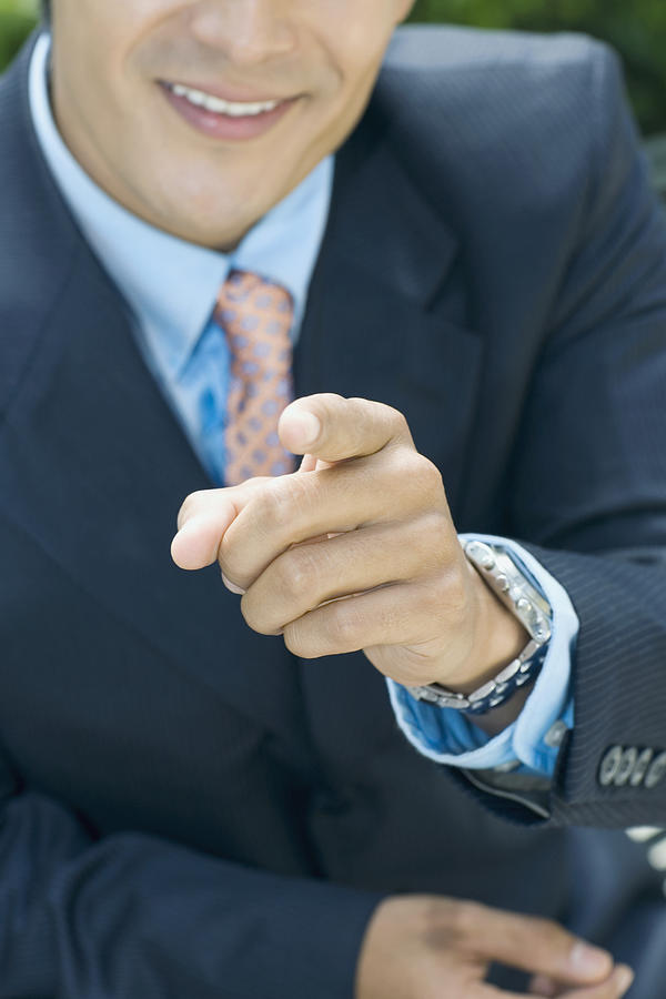 Close-up of a businessman pointing forward Photograph by Glowimages