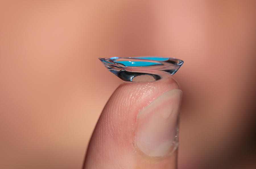 Close-up of a contact lens on a womans finger Photograph by Blurf