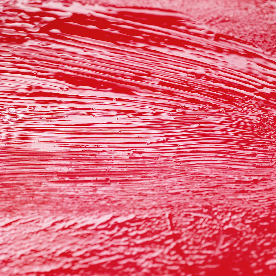 Close-up of a fresh coat of red paint on a wooden surface Photograph by Stockbyte