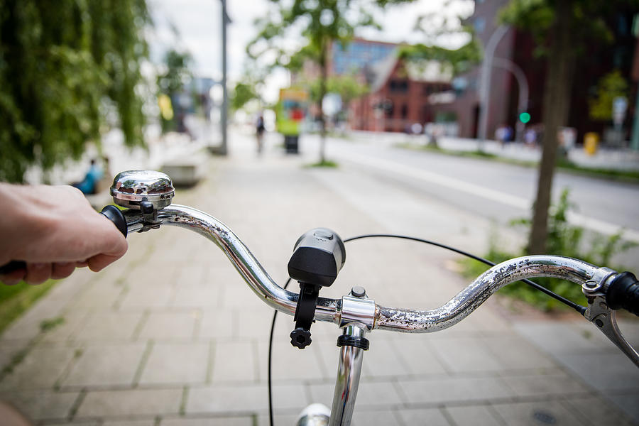 Close up of a Mans Hand Holding a Bicycle Handlebar in Hafen City, Germany in Spring Photograph by Morten Falch Sortland