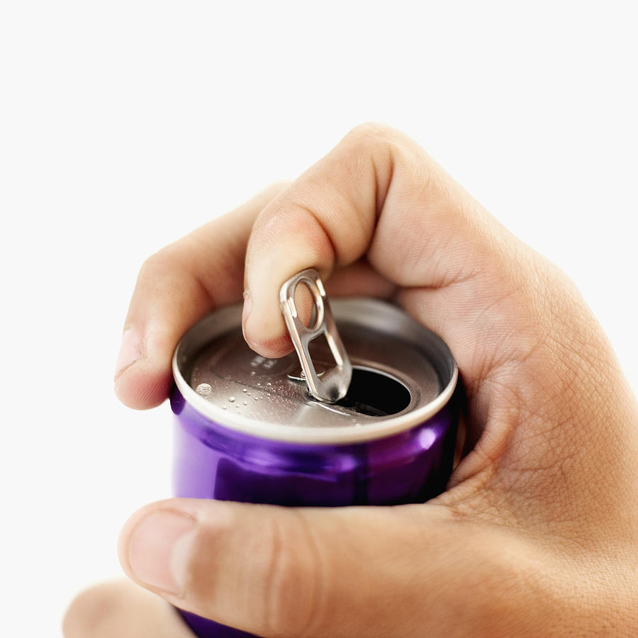Close-up of a mans hand opening a can Photograph by Stockbyte