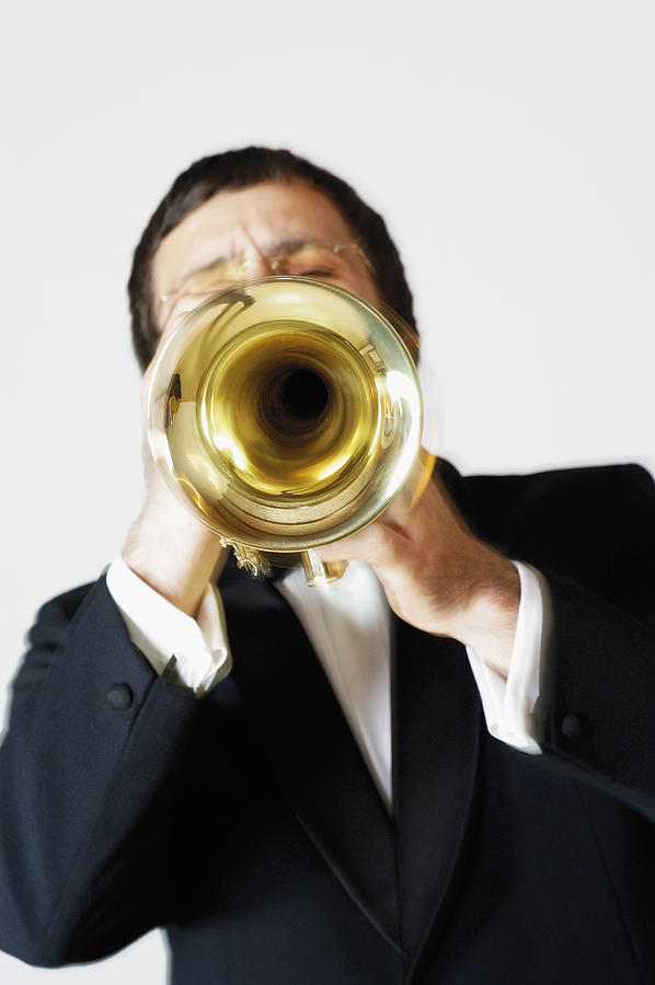 Close-up of a musician playing the trumpet Photograph by Glowimages