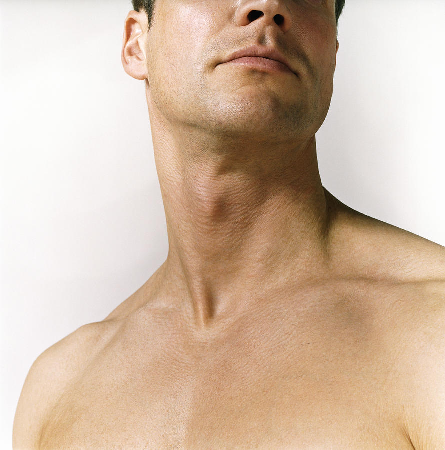 Close Up of a Naked Mans Neck Photograph by Digital Vision.