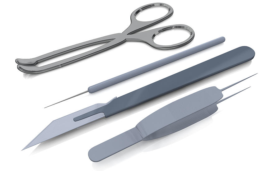 Close-up of a pair of scissors and a scalpel with a pair of tweezers Drawing by Medioimages/Photodisc