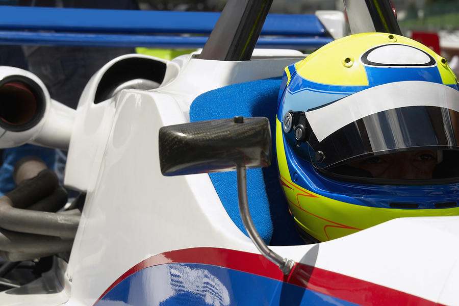Close-up of a racecar driver in a racecar Photograph by Glowimages