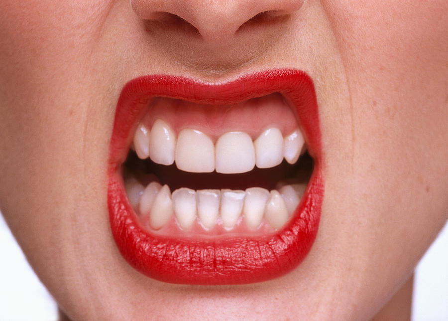 Close-up Of A Woman Exposing Her Teeth Photograph by George Doyle