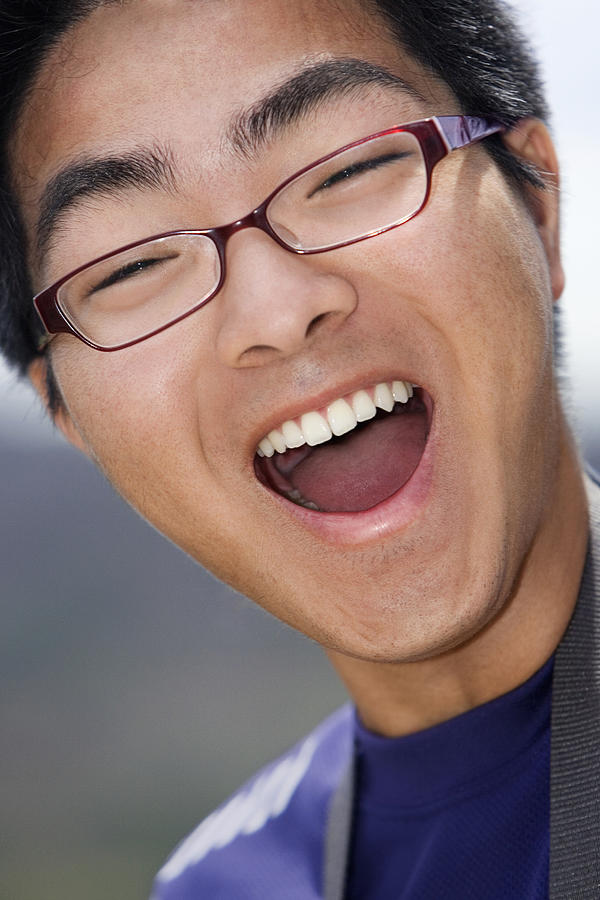 Close-up of a young man laughing Photograph by Glowimages