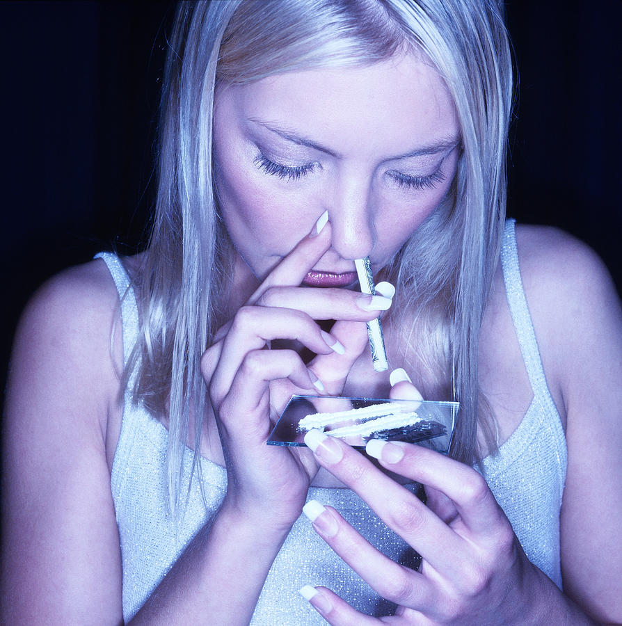 Close-up Of A Young Woman Snorting Drugs Photograph by George Doyle