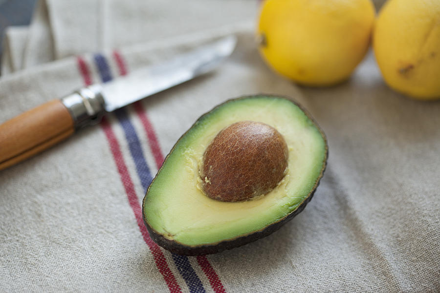 Close-up of avocado on napkin Photograph by Halfdark