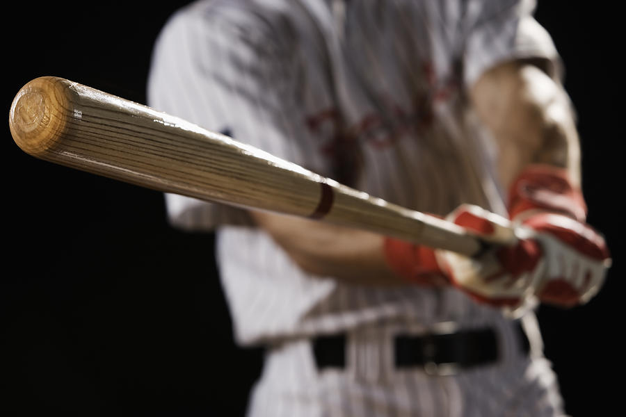 Close up of baseball player swinging bat Photograph by Hill Street Studios