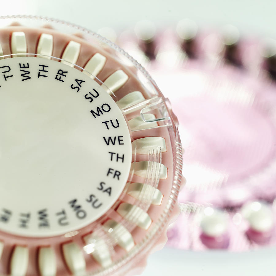 Close-up of birth control pills in two plastic tablet dispenser cases Photograph by Stockbyte