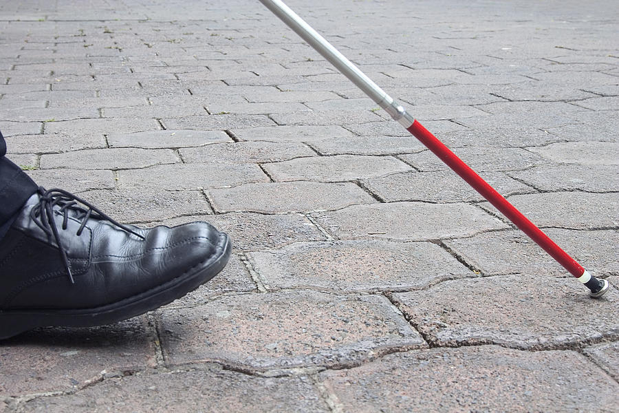 Close-Up of Blind Mans Black Shoe and White Cane Walking Photograph by Abalcazar