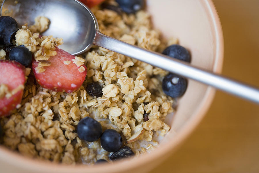 Close-up of bowl of cereal and berries Photograph by Thinkstock Images