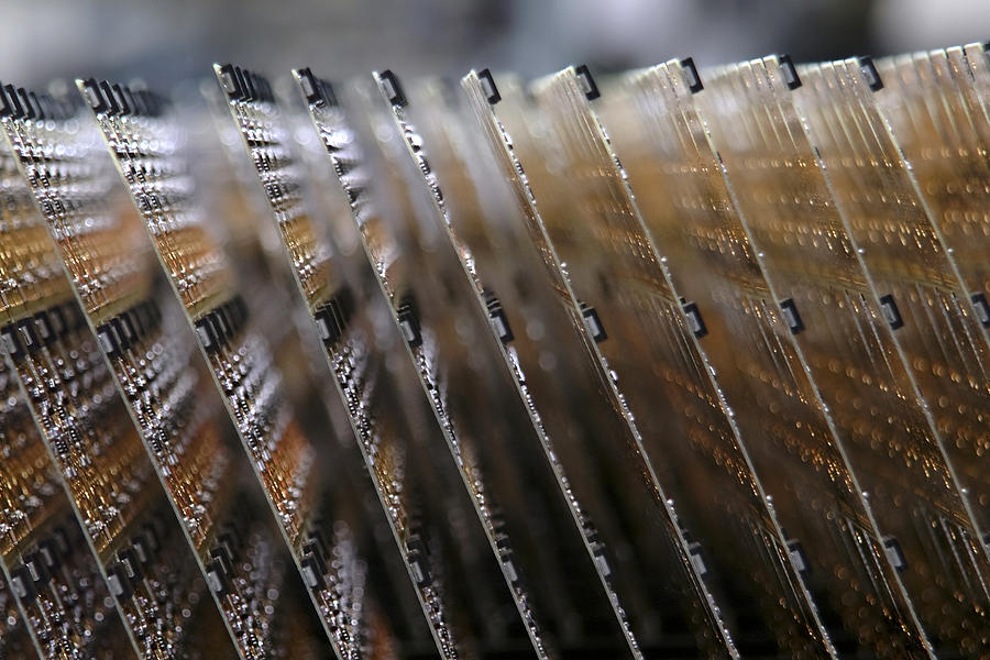 Close up of circuit boards on assembly line Photograph by Spiderplay
