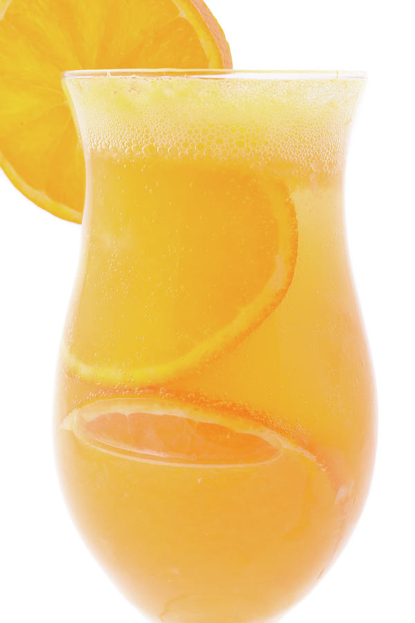 Close Up Of Cocktail Glass Of Orange Juice With Peaces Of Orange Inside Photograph