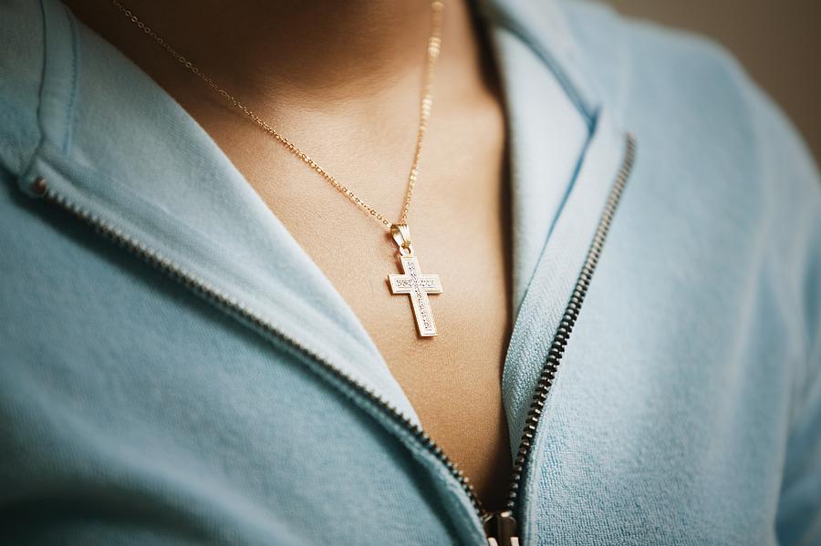 Close up of cross necklace on woman Photograph by Jose Luis Pelaez Inc