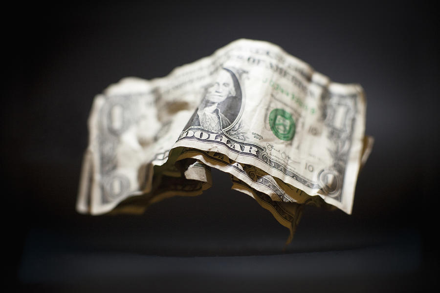 Close-up of crumpled old American one dollar bills levitating against black background Photograph by Ralf Hiemisch