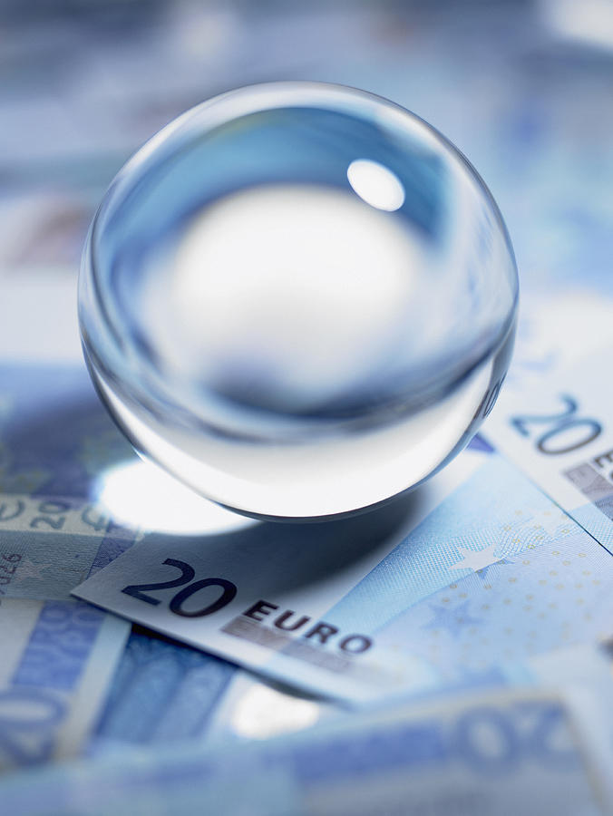 Close up of crystal ball on 20 euro notes Photograph by Adam Gault