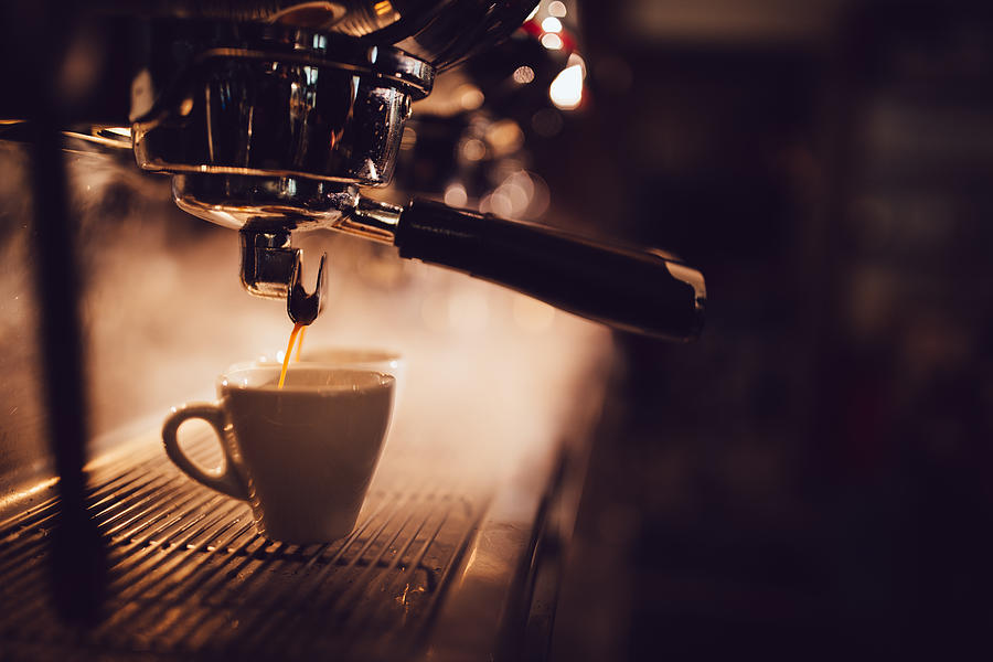 Close-up of espresso machine brewing a cup of coffee Photograph by Wundervisuals