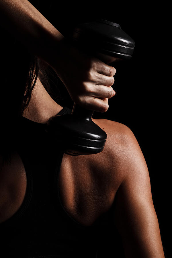 Close Up of female hand with dumbbell Photograph by Alexandr Sherstobitov