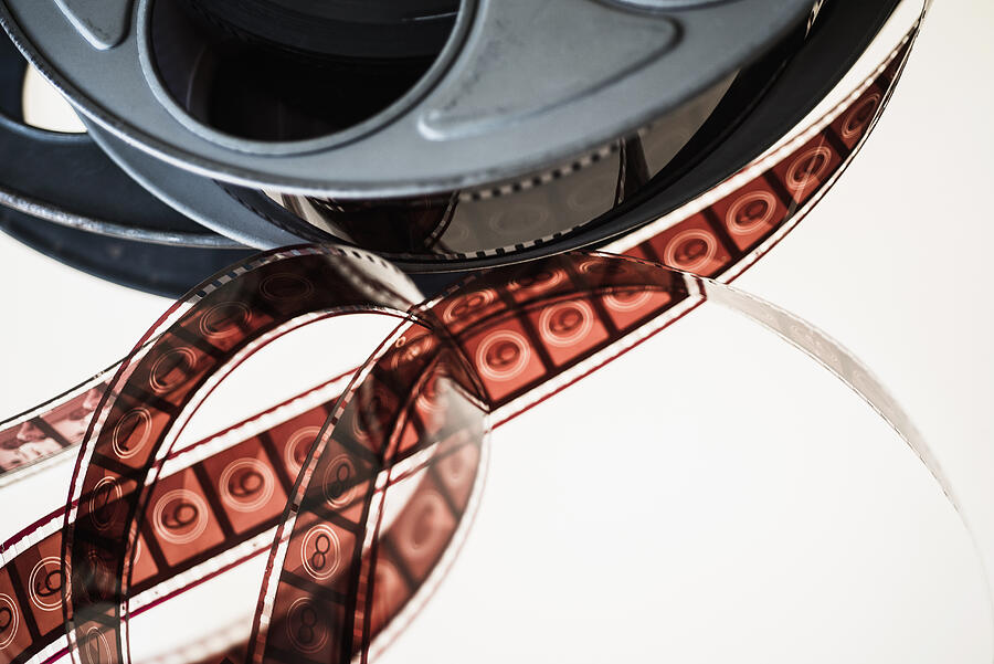 Close-up of film reel against white background Photograph by Tetra Images