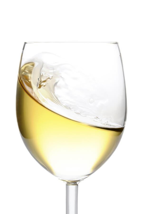 Close-up of glass of white wine isolated on white background Photograph by Domin_domin