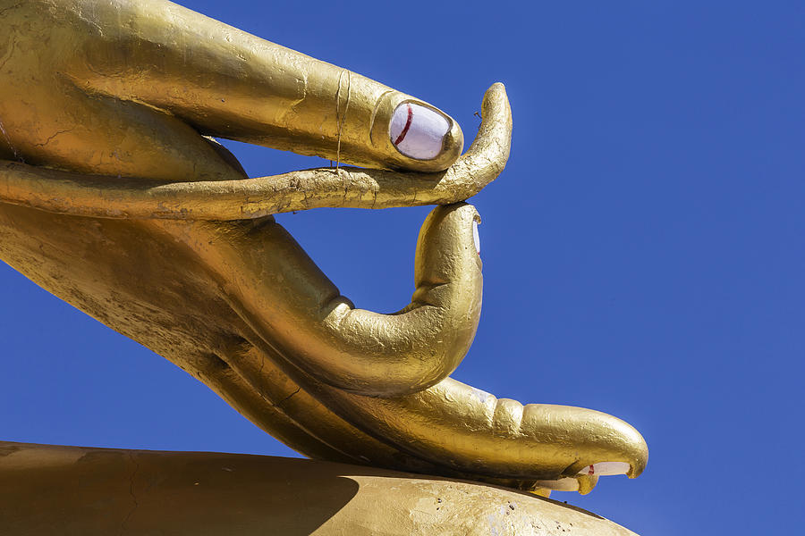 Close up of golden hand statue against blue sky Photograph by Jeremy Woodhouse
