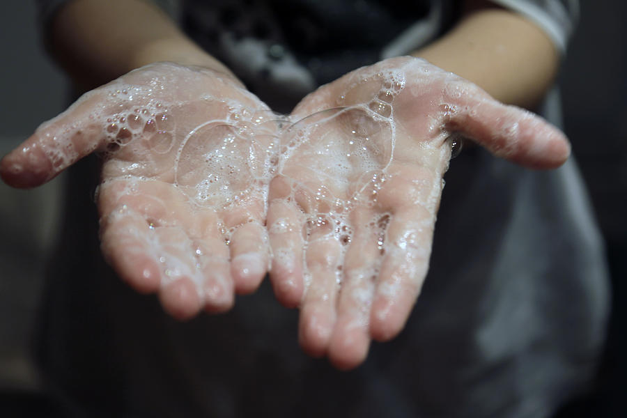 Close-up of hands with soap Photograph by Isabel Pavia