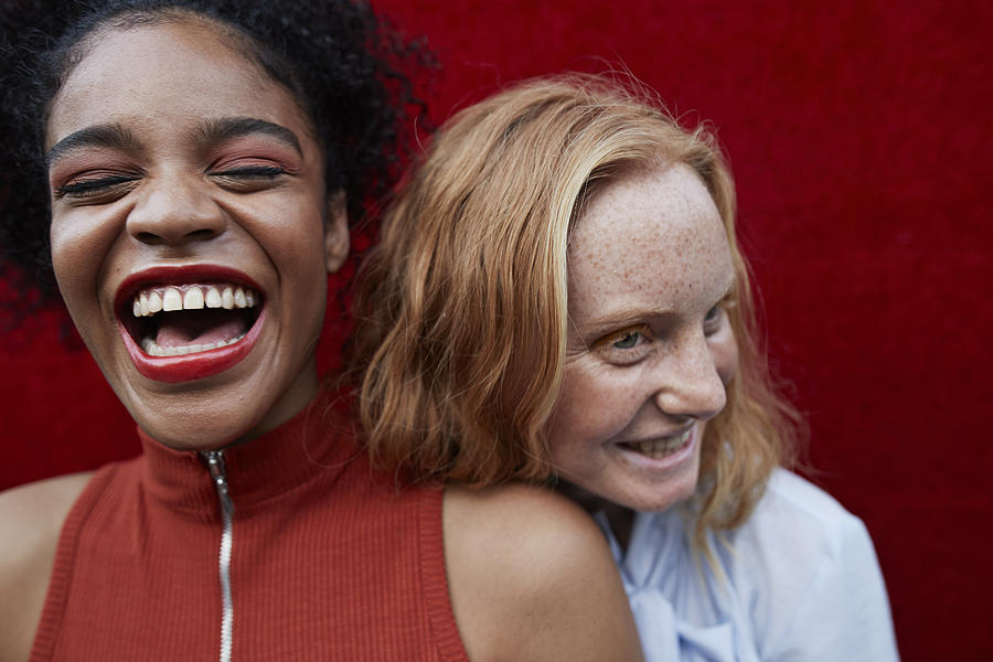 Close-up of happy young females standing outdoors Photograph by Klaus Vedfelt
