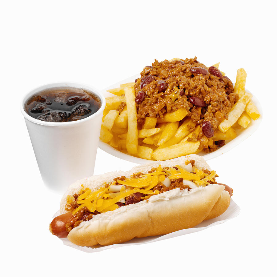 Close-up of hotdog and chili french-fries with cold drink Photograph by Ciaran Griffin