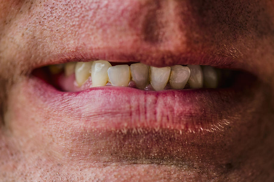 Close up of lips of Caucasian man grimacing Photograph by Eric Raptosh Photography