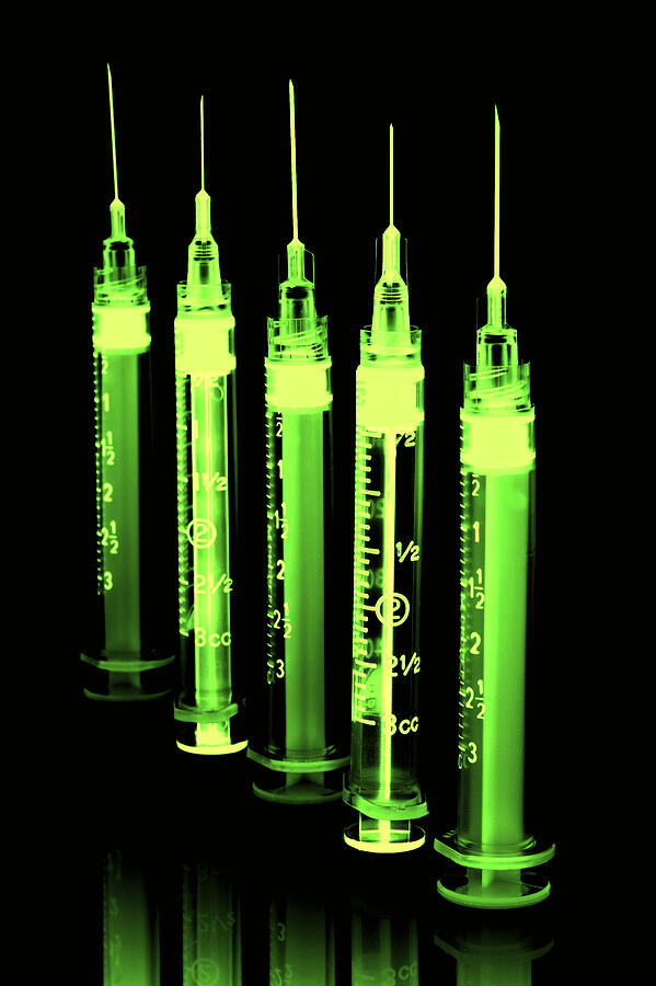 Close up of medical syringes.  Photograph by Lucidio Studio, Inc.