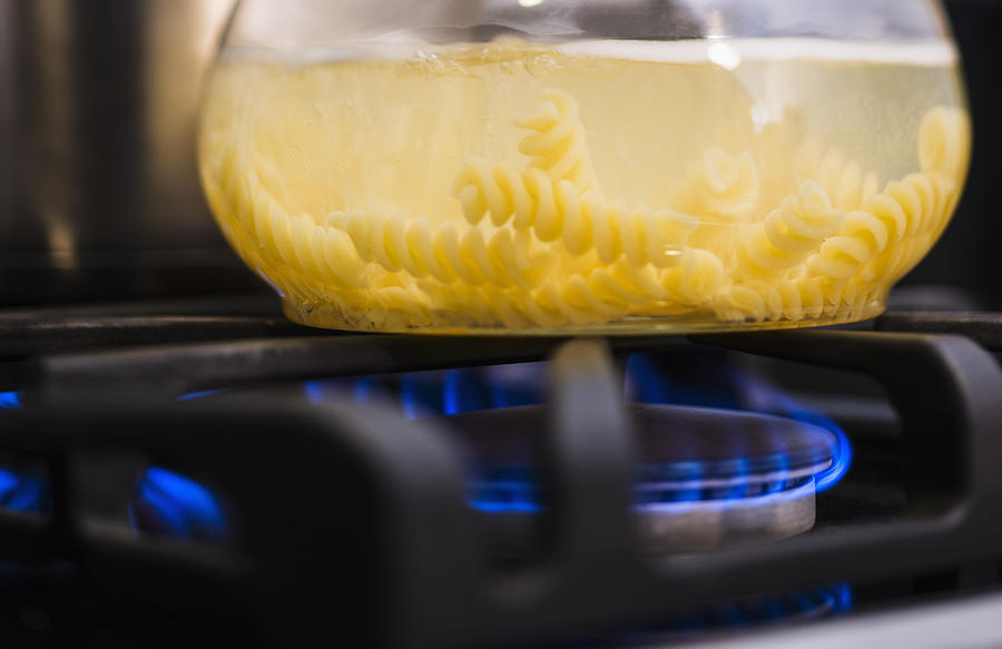 Close-up of pasta boiling on gas burner Photograph by Tetra Images