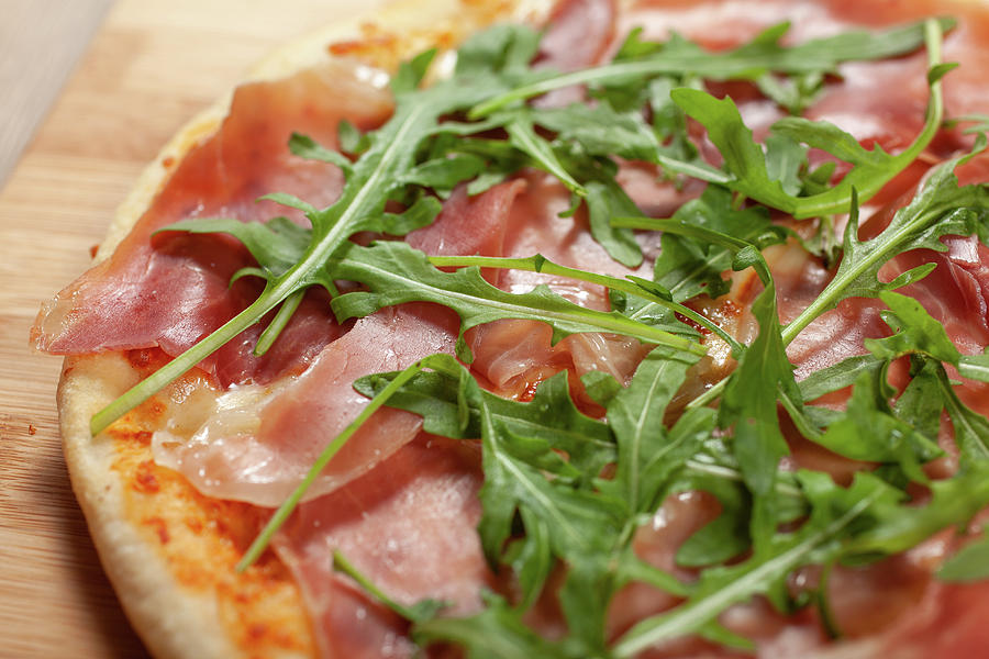 Close Up Of Pizza With Prosciutto And  Arugula Photograph