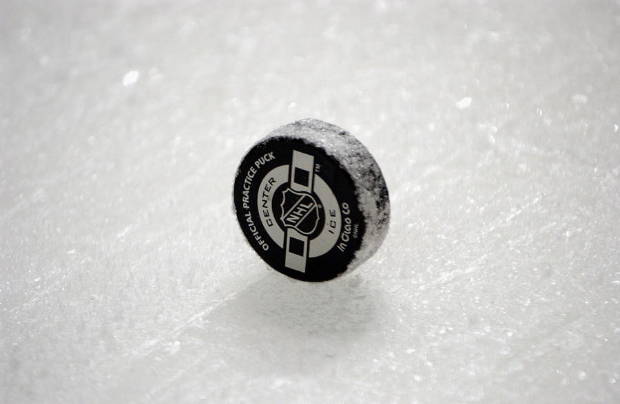 Close-up of puck Photograph by Doug Pensinger